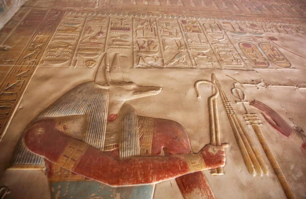 Anubis Depicted - ancient Egyptian god with jackal head. Anubis was the god of mummification. Temple to Osiris at Abydos, Egypt