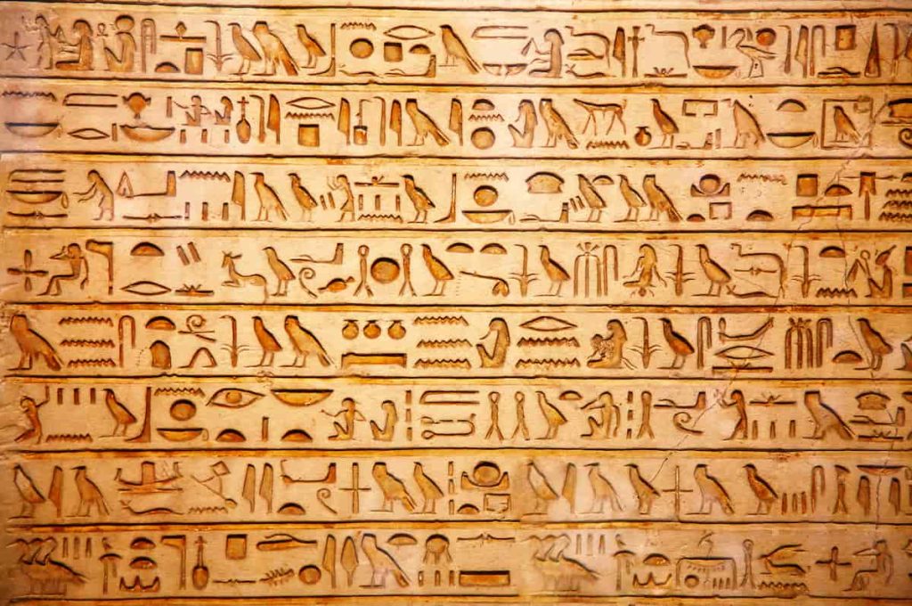 old egypt hieroglyphs carved on the stone