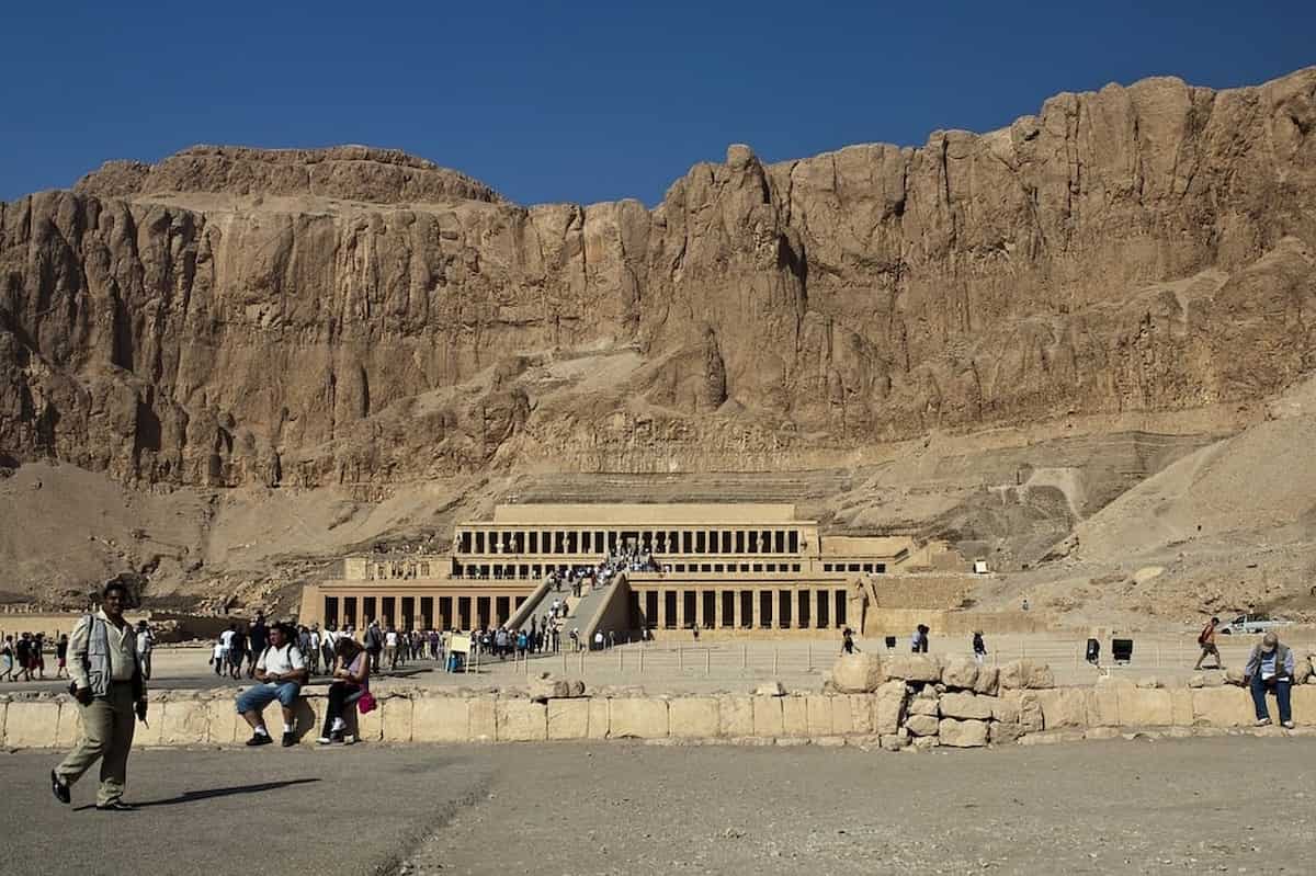 A group of people standing in front of the Valley of the Kings