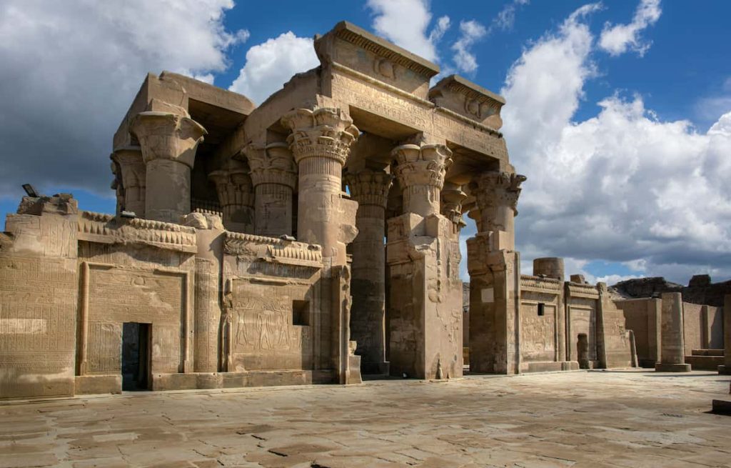 The ancient Egyptian temple of Kom Ombo with clear blue sky and clouds