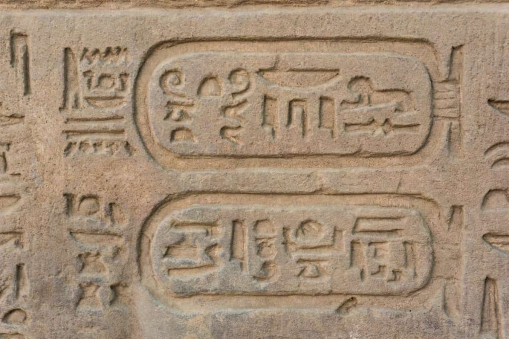 old egypt hieroglyphs carved on the stone. Detail from temple wall in Egypt.