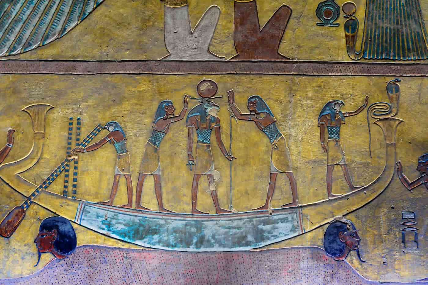 Ancient mural of an egyptian boat with gods