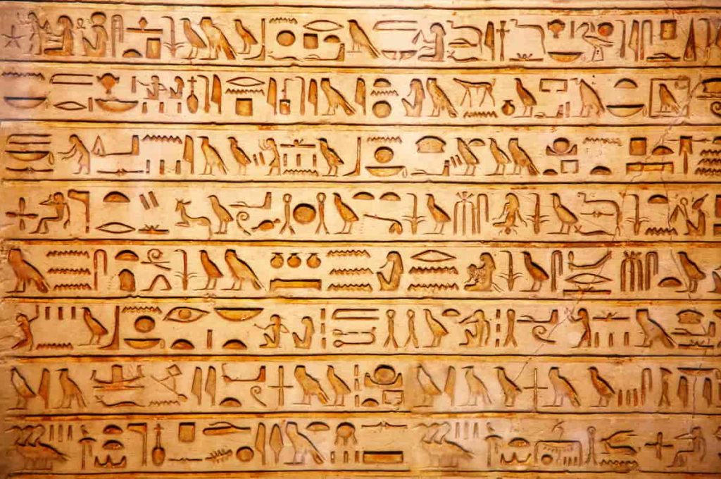 old egypt hieroglyphs carved on the stone