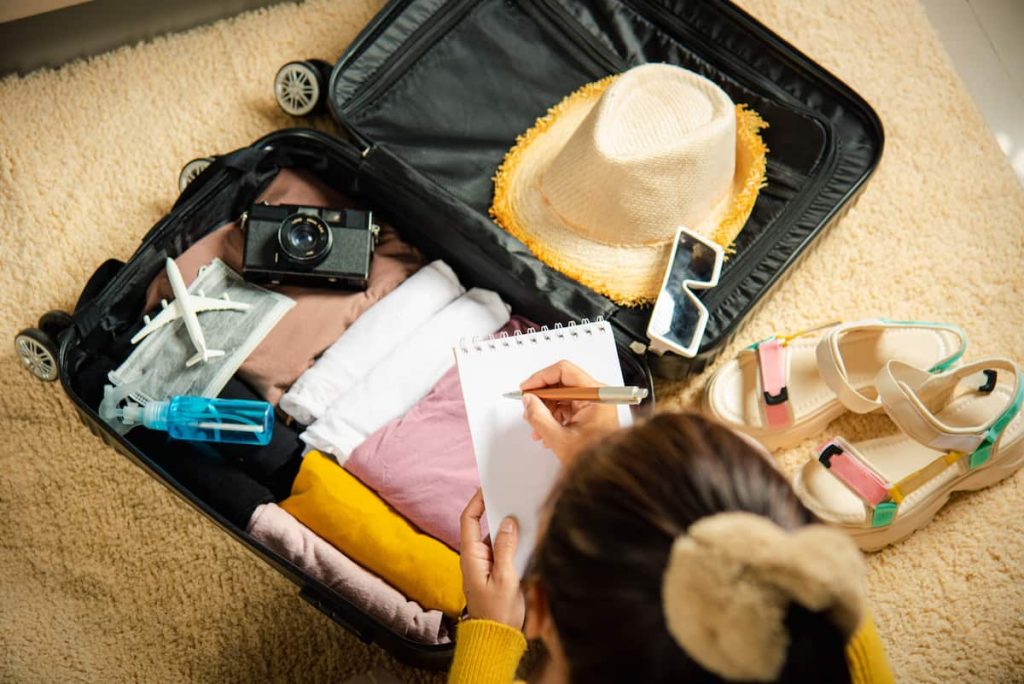 Making check list of things to pack for travel. 
