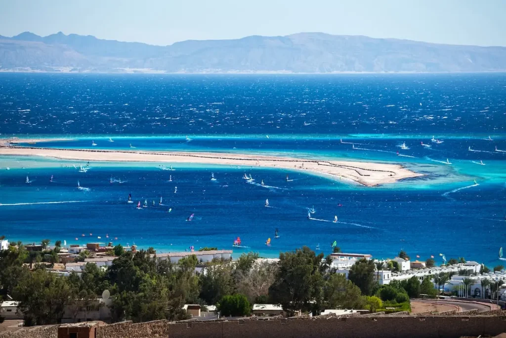 Lagoon full of windsurfers in the town of Dahab, Egypt
