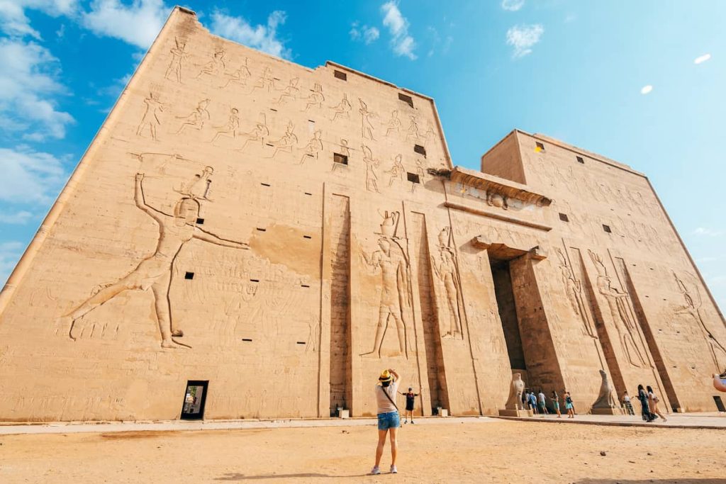 walls of edfu temple, full of hieroglyphics in edfu city.