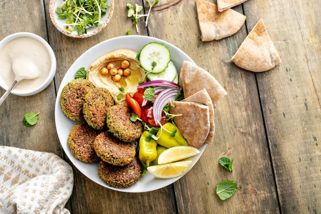 Baked falafel bowl with hummus and fresh vegetables