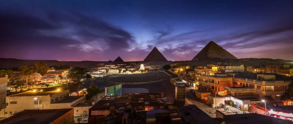 The Pyramids and the Sphinx in the night lights, Giza, Egypt