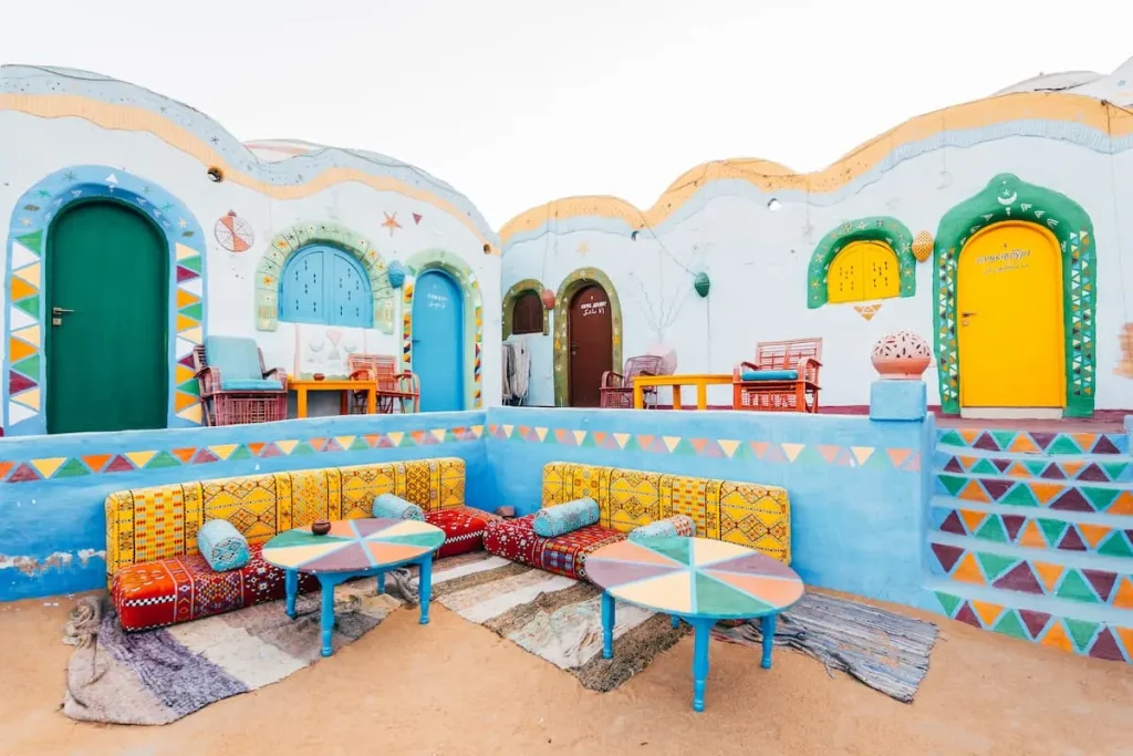 colorful houses of nubian village in aswan, egypt
