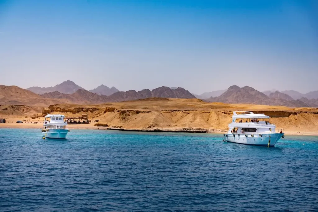 Touristic dive boats near Ras Mohammed coral reef on Sinai Peninsula in Egypt.