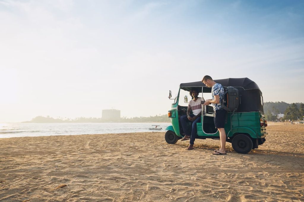 Tuk-tuks driver with passenger
