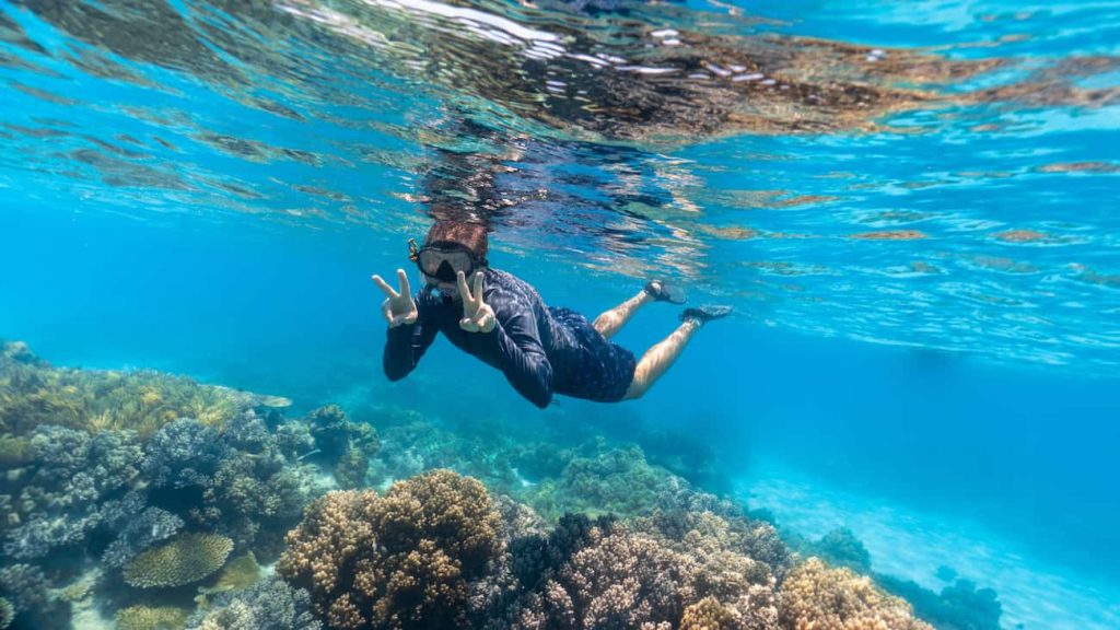 young man snorkeling 