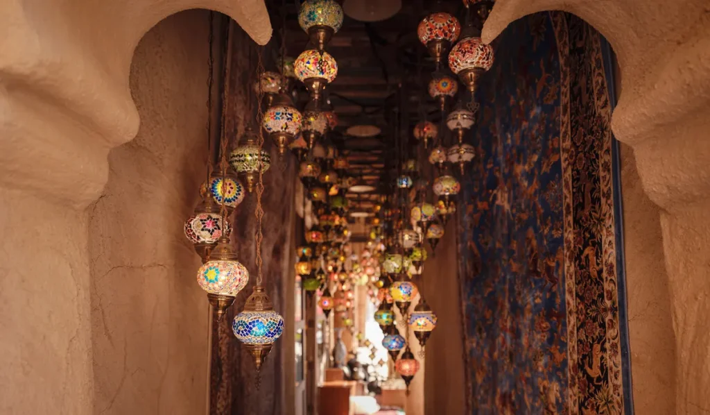 Al seef old historical district with traditional Arabic architecture. Beautiful Traditional Ramadan Light Lamp in shop Dubai Spice Souk.