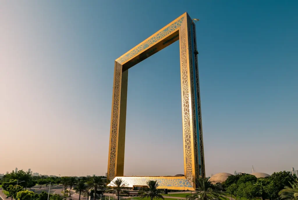  Dubai Frame. Dubai Frame golden tower building at sunrise. Dubai's famous modern architecture on colorful sky background.