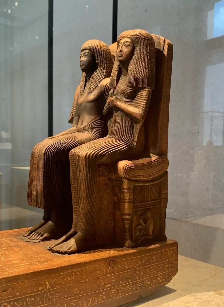 Seated figure of the chief of the craftsmen Amenemope and his wife Hathor