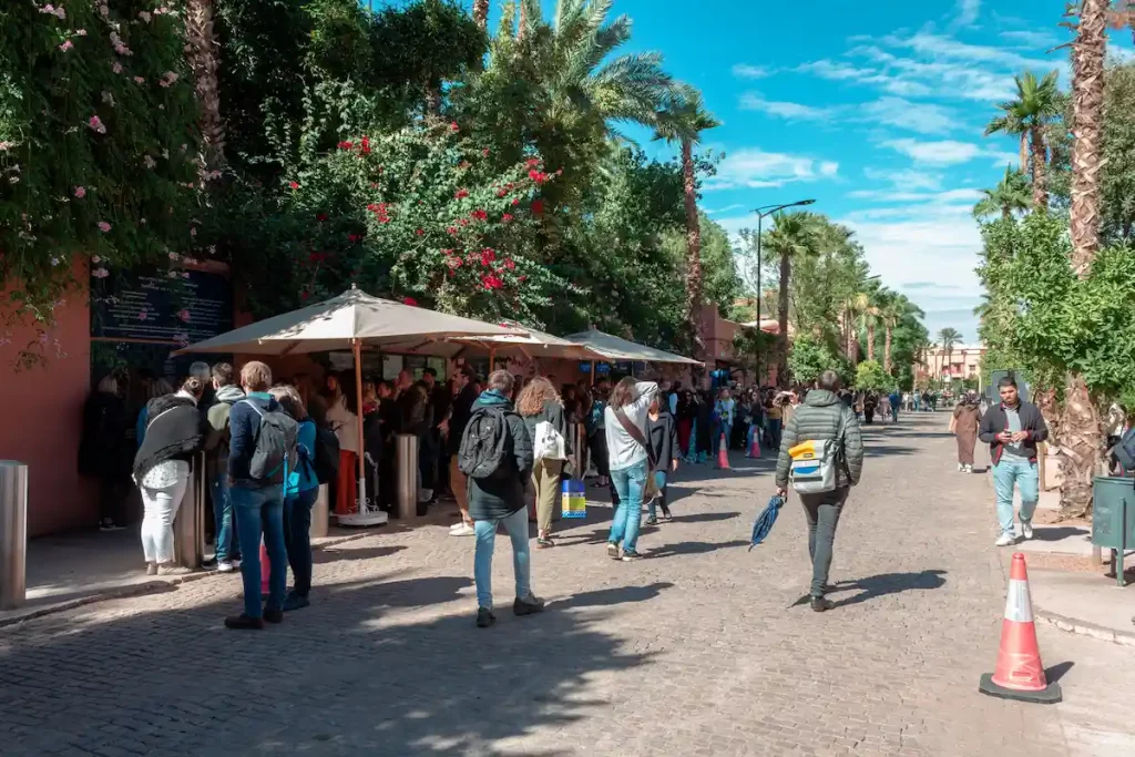 Tourists in the queue in front of the ticket office of Yves Saint Laurent Museum.