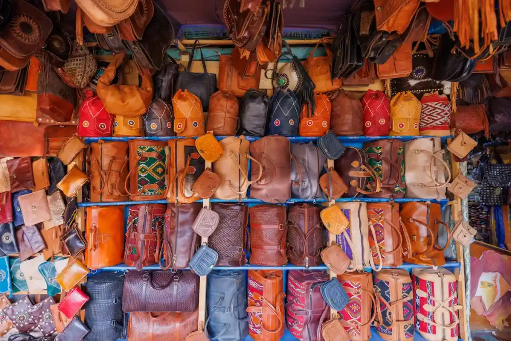 Leather goods on sale at the Chouara Tannery, in the Medina quarter of Fez el Bali, Fez, north west Morocco