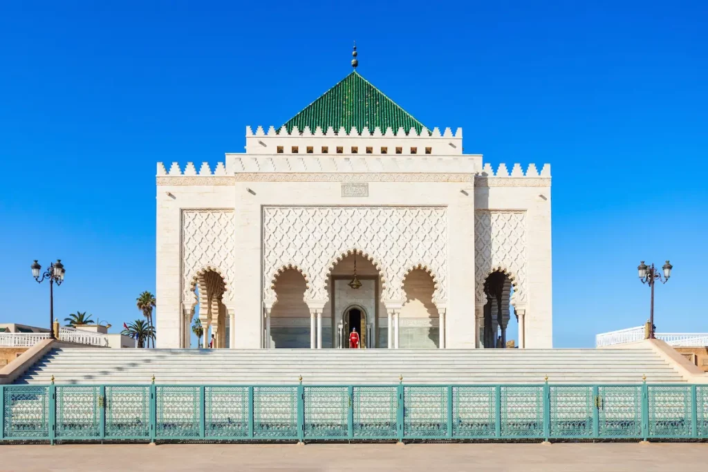 The Mausoleum of Mohammed V is located on the opposite side of the Hassan Tower on the Yacoub al-Mansour esplanade in Rabat, Morocco. 
