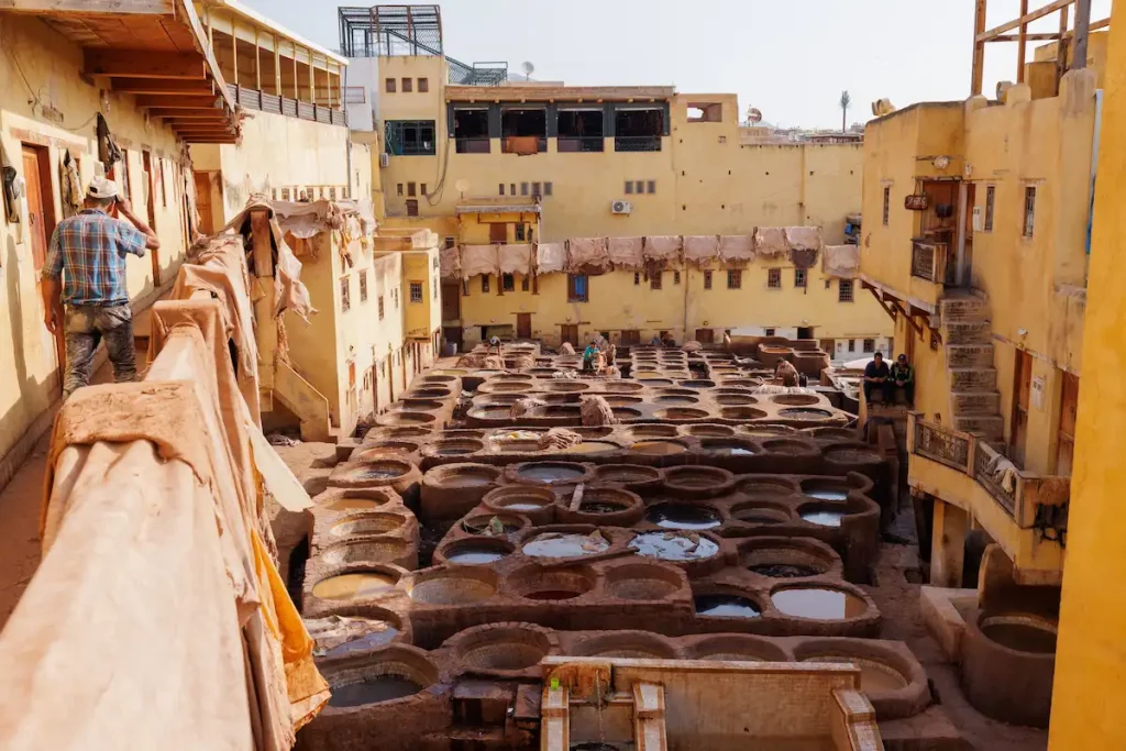 orkers treat leather with softening liquids and dyes at Chouara Tannery