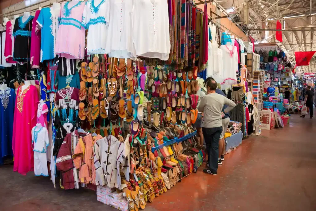 Shop selling clothes and shoes, in a corner of one of the interior corridors of Souk El Had market