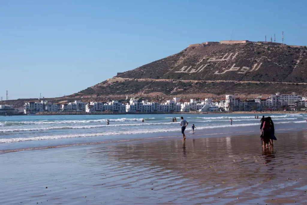 City beach and view of the Marina and mountain on which stands the old and destroyed kasbah