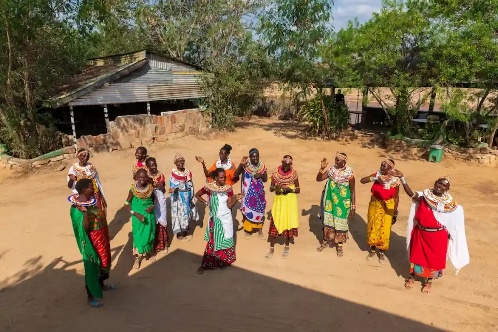. A group of women from the Umoja Women Cultural village welcomes tourists.