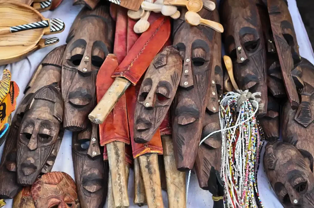 Masks and knives handmade by the Maasai tribes selling on the traditional souvenir marketÂ in Nairobi, Kenya