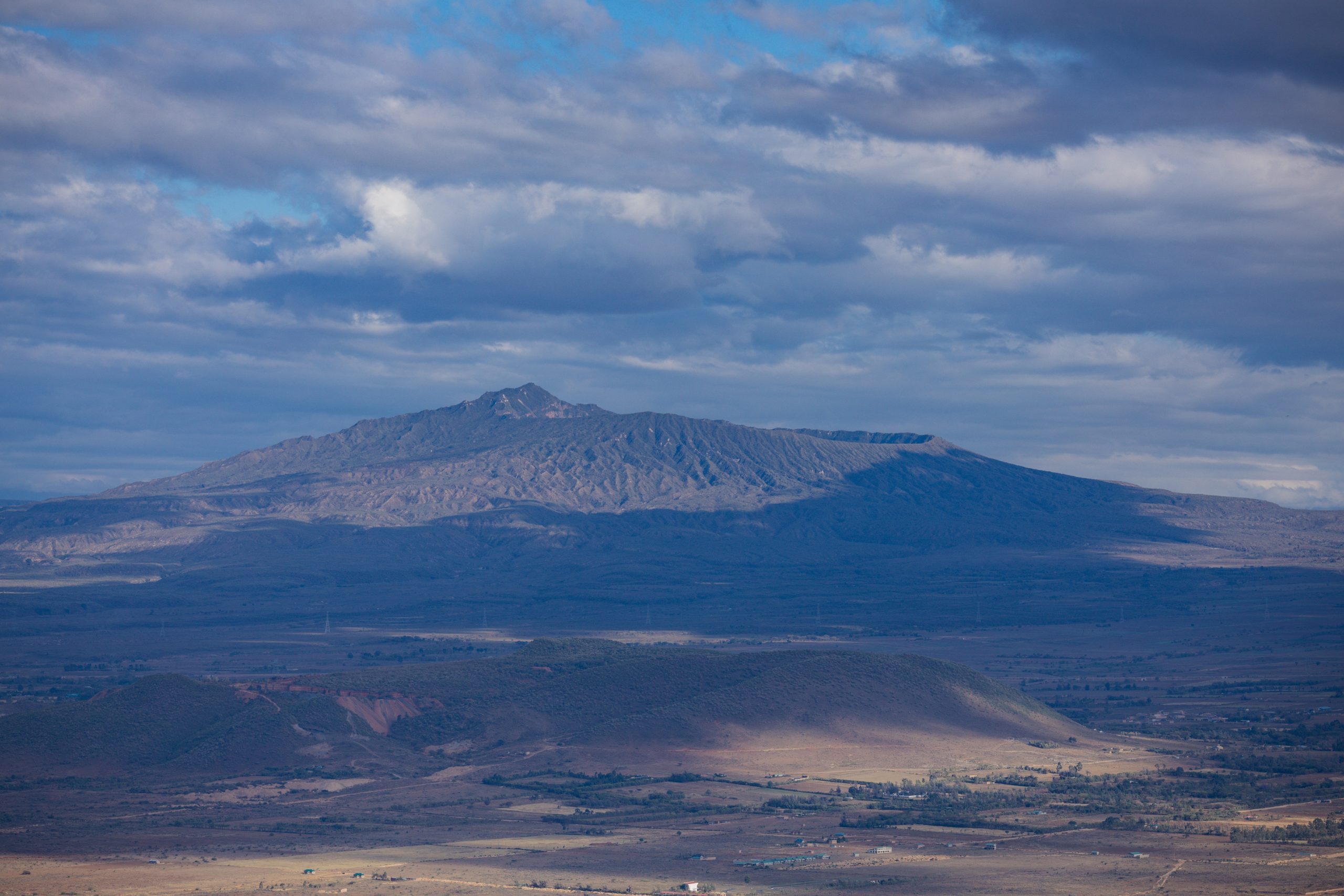 Mount Longonot is a stratovolcano located southeast of Lake Naivasha in the Great Rift Valley of Kenya, Africa. It is thought to have last erupted in the 1860s. Its name is derived from the Maasai wor