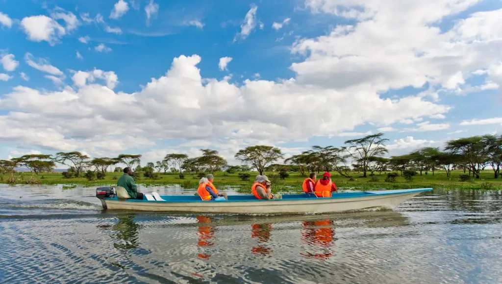 Unidentified tourists on a boat excursion on Lake Naivasha in Kenya