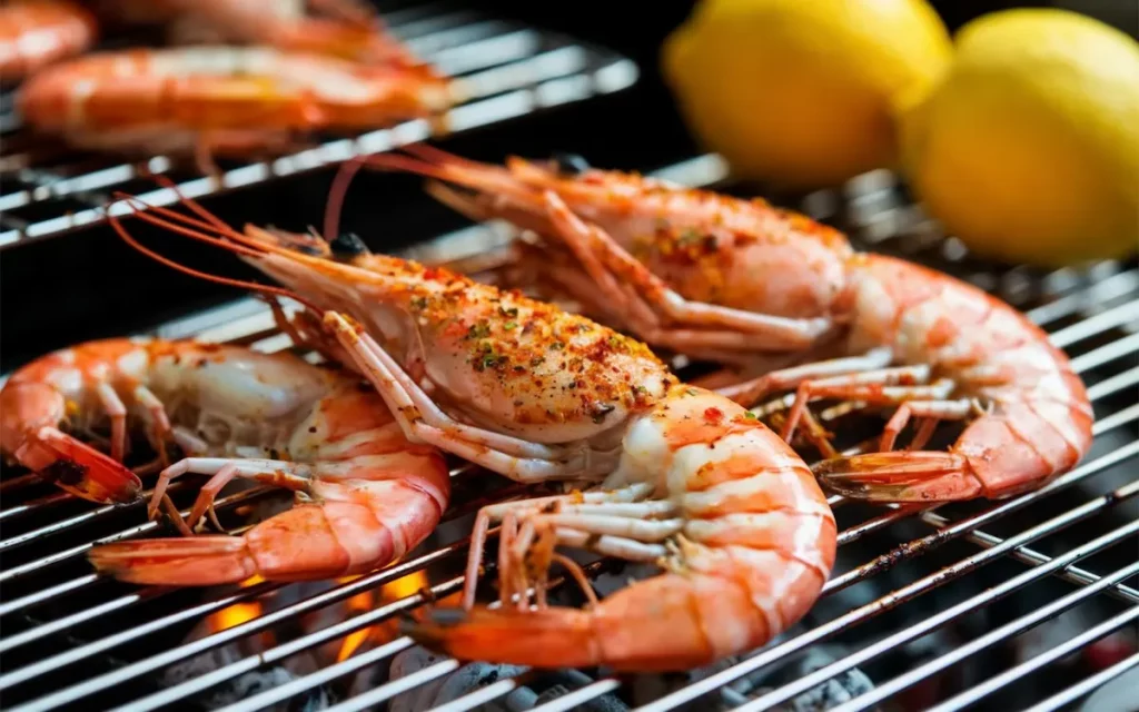 Prawns on the Barbie: A classic Australian dish where prawns are seasoned and grilled on a barbecue, often served with lemon and dipping sauce.