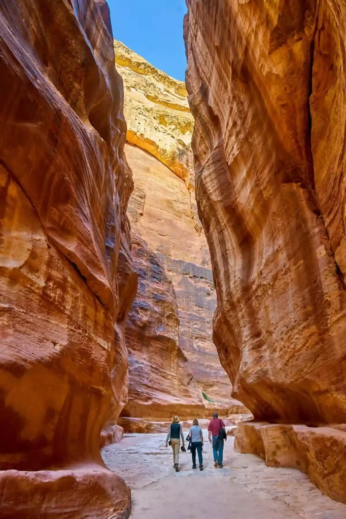 Tourists walking through the Siq, Petra, Jordan