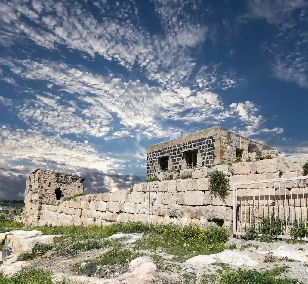 Roman ruins at Umm Qais (Umm Qays)--is a town in northern Jordan near the site of the ancient town of Gadara, Jordan. Against the background of a beautiful sky with clouds