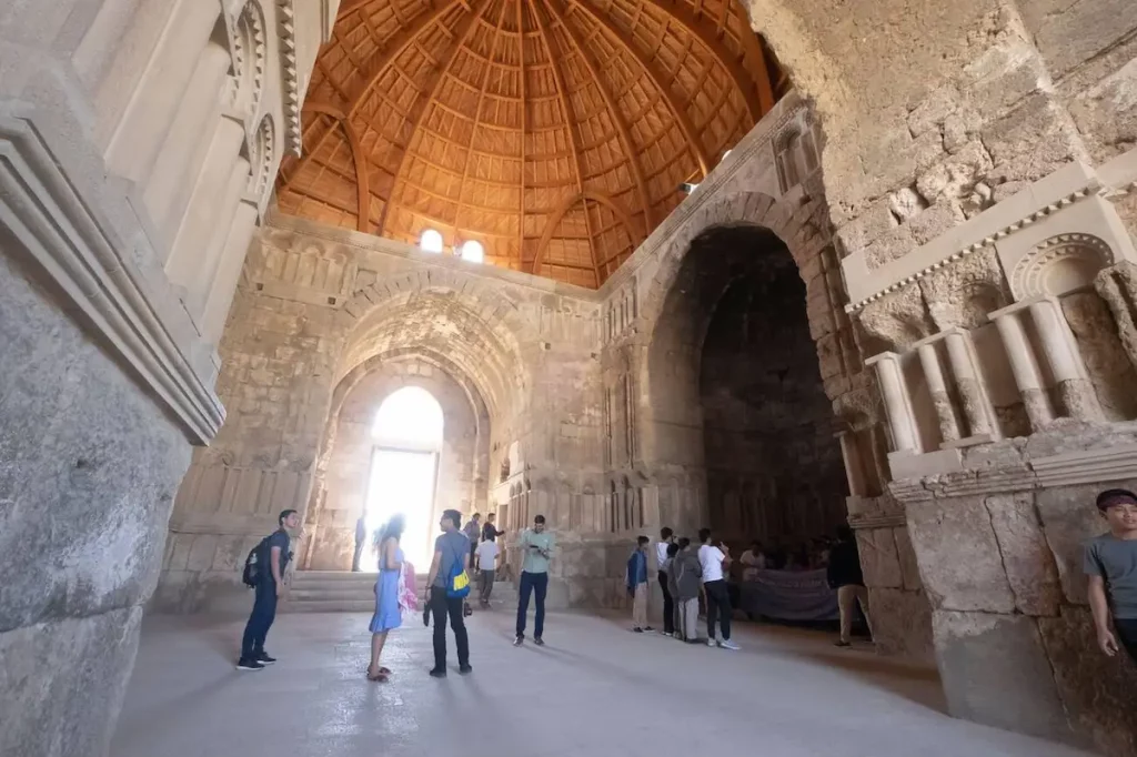 Tourists at the Old Umayyad Palace ruins, Amman Citadel, in Jordan. Interior view. A preserved building at Jabal al-Qal'a, a national historic site