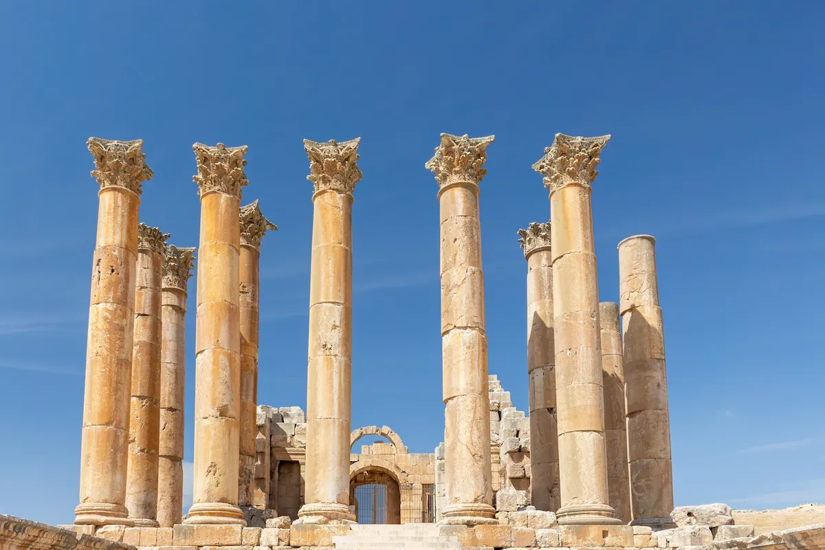 Corinthian columns surround the temple or Sanctuary of Artemis in Jerash Jordan.