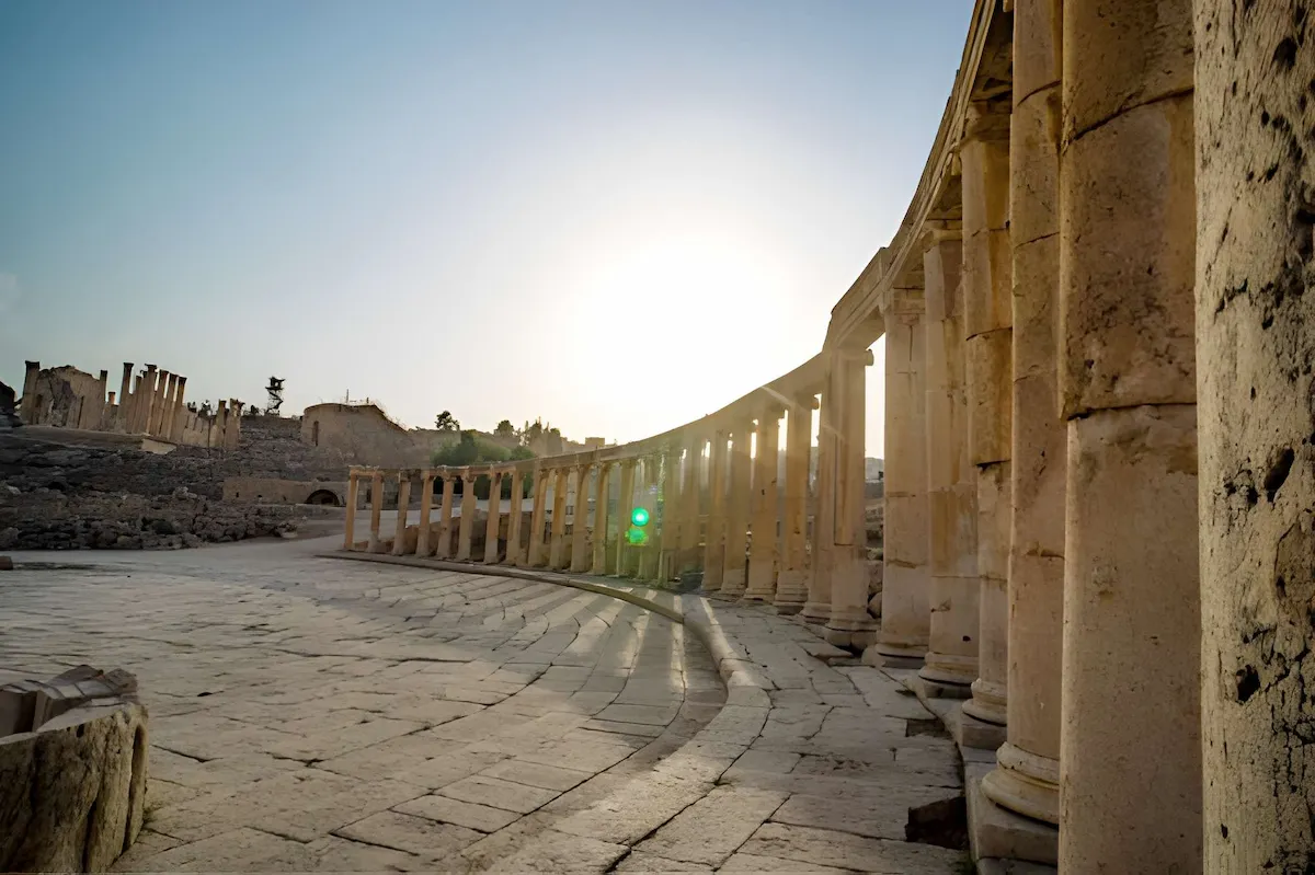 Ancient Roman city of Gerasa, Columns of the cardo maximus, Arch of Hadrian, Temple of Artemis - Jerash, Jordan. oval forum