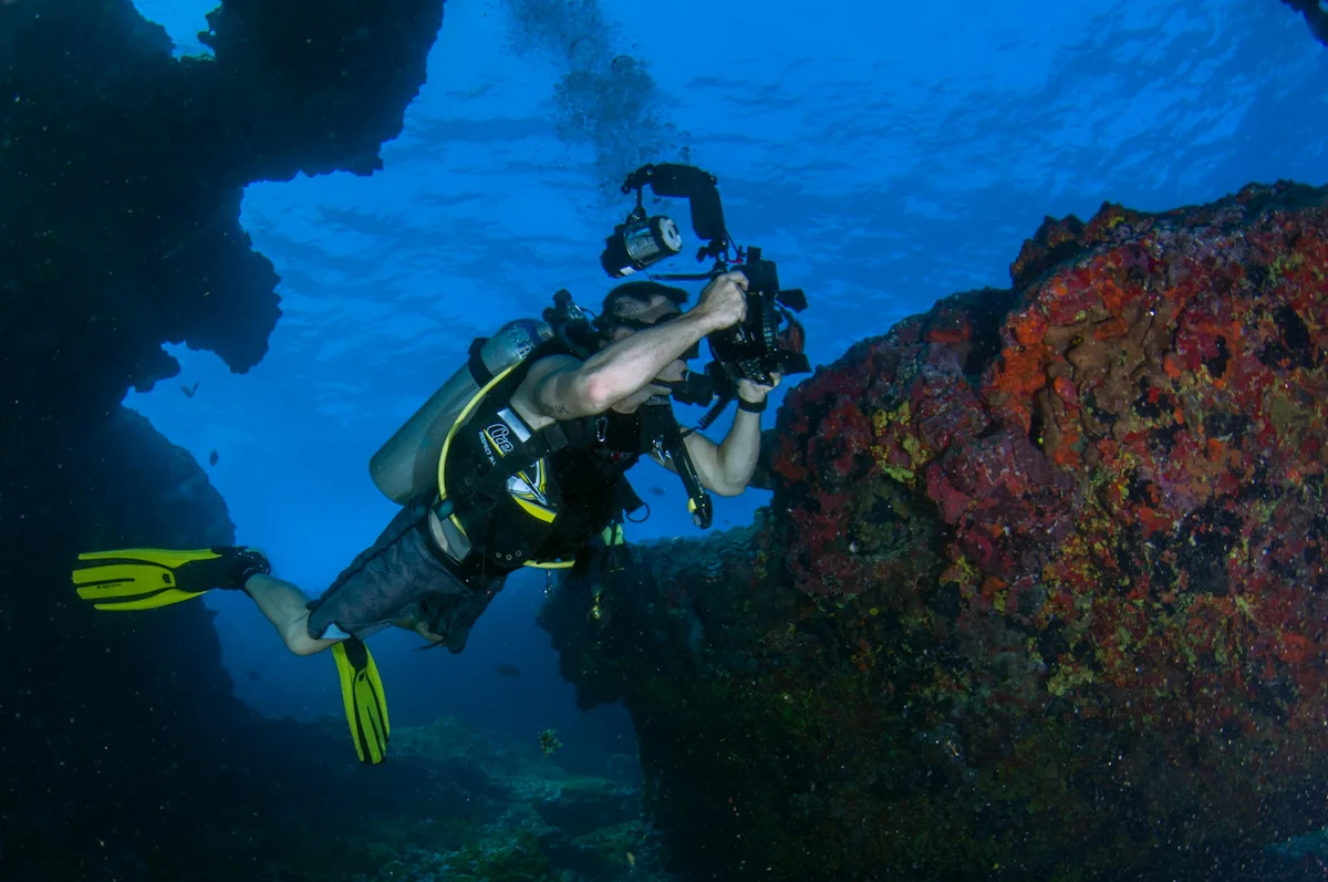 A Diver Holding a Camera
