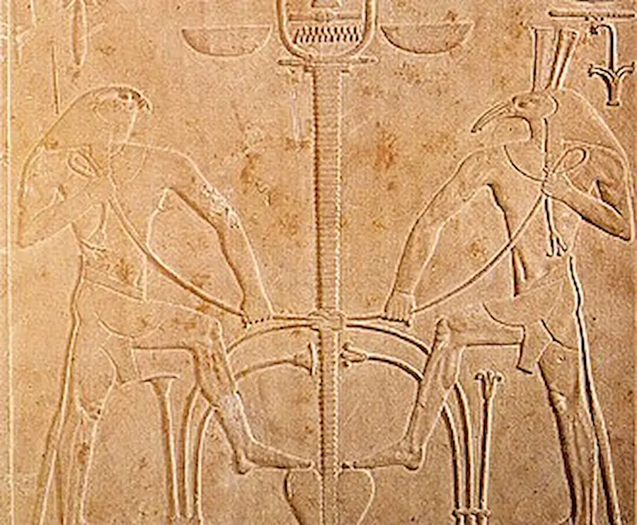 Photograph of a detail of the throne of Sesostris I showing the gods Horus and Seth performing the ritual of the meeting of the Two Lands